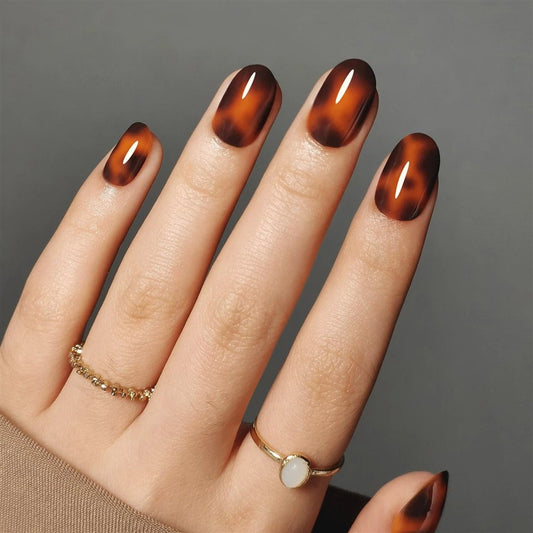 Hand with clawture spirit animal press on nails on a gray background