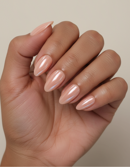 Hand with beige nail polish on a neutral background
