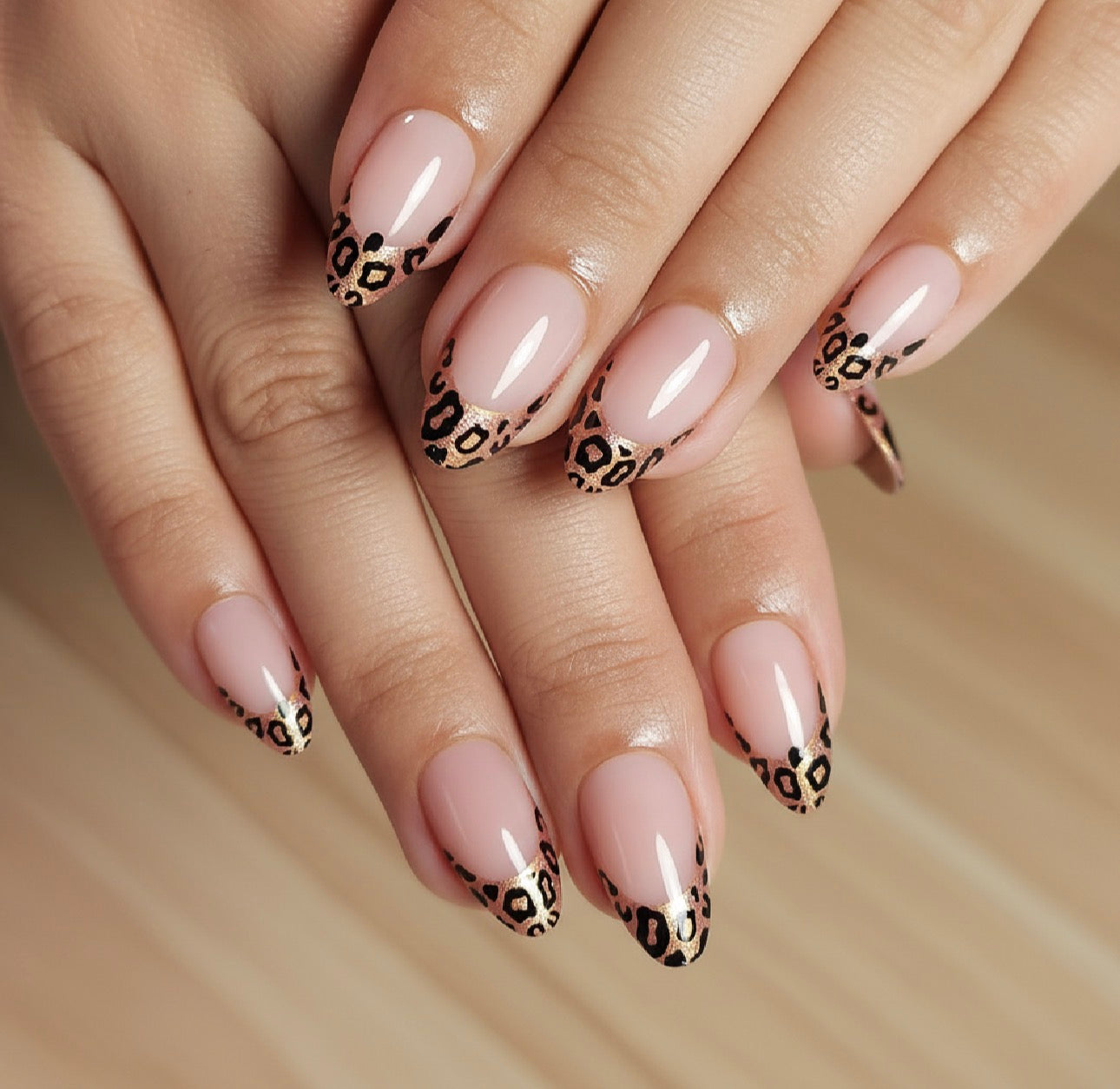 Nails with Clawture Wild French tip false press on nails and black leopard print design on a neutral background
