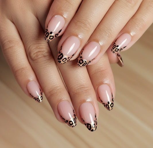 Nails with Clawture Wild French tip false press on nails and black leopard print design on a neutral background