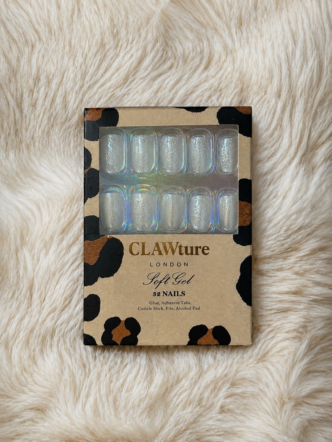 Box of clawture angel aura silver cat eye false press on nails London soft gel nails on a fur surface