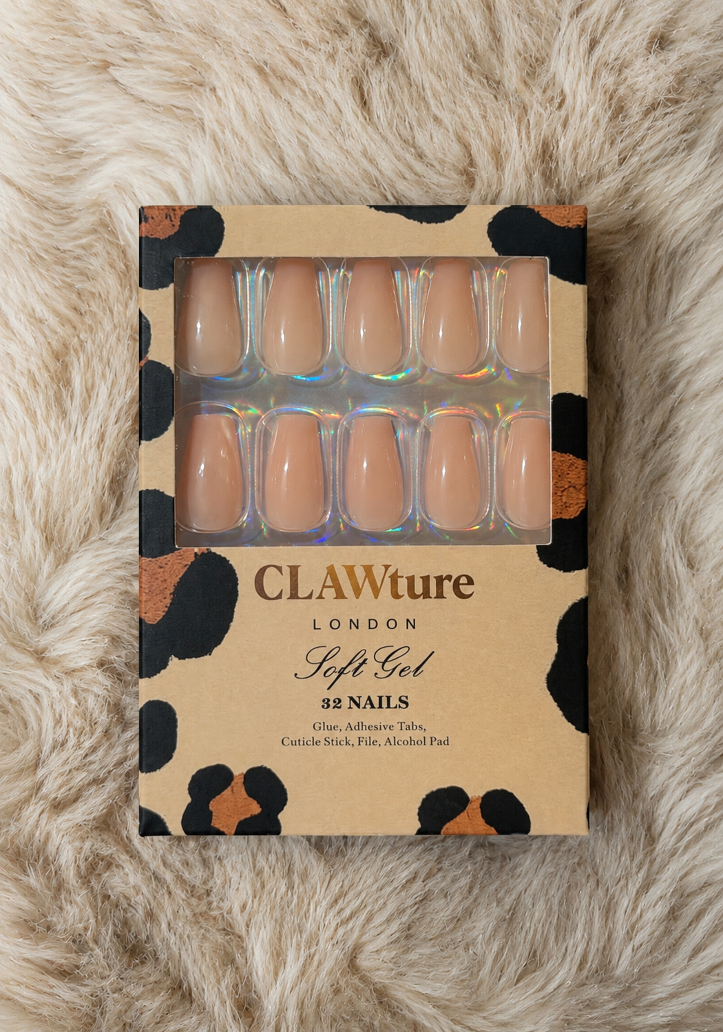 Box of CLAWture London soft gel nails clawture cashmere false press on nails coffin ballerina on a fur surface