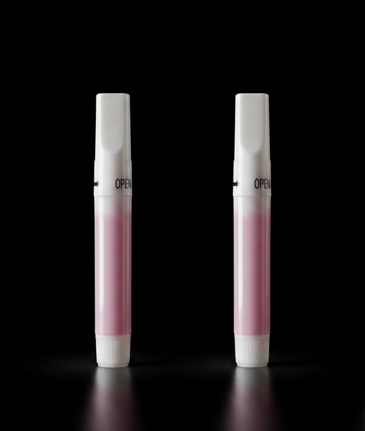 Two white and pink clawture glue applicators with 'OPEN' text on a black background