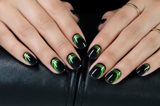 Close-up of hands with black and green nails on a dark background clawture hidden emerald press on nails