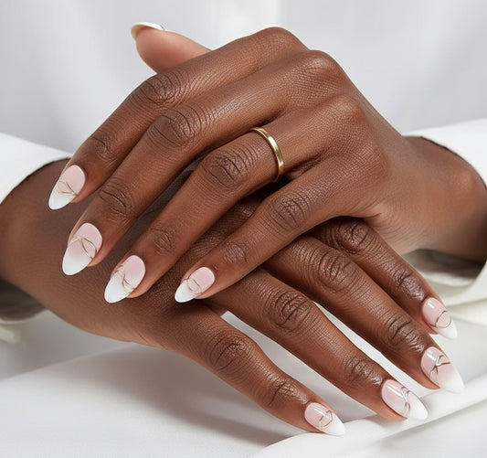 Close-up of a hand with Clawture Luxury Lines press on nails with pink, white and silver colors on a white background.