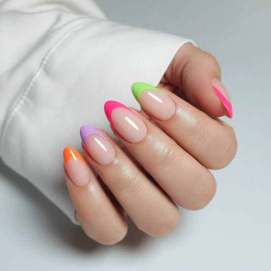 Close-up of a hand with colorful Clawture Paris Pop press on nails on a neutral background
